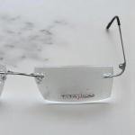 نظارة تنفيذية بدون إطار بلون فضي مع أذرع فائقة النحافة