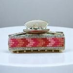 مشبك شعر نسائي مرصع بالكريستال – أناقة الغروب الوردي