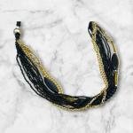 عقد متعدد الخيوط من الخرز مع لمسات ذهبية وسوداء